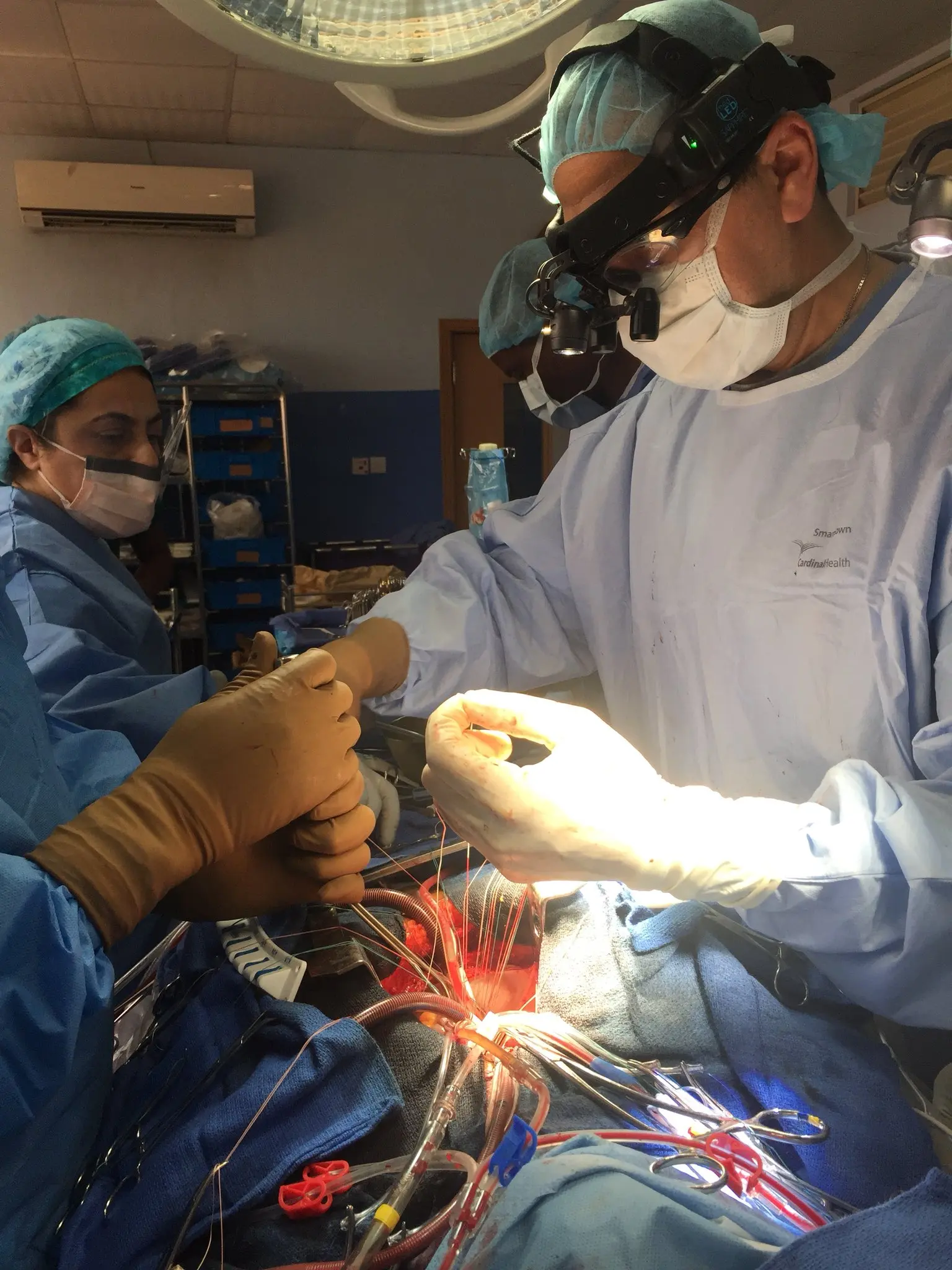 Medical professionals performing vascular procedure